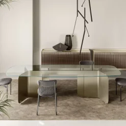 Tavolo con Piano Sagomato in Vetro e Base in Metallo Curvato - Piacere